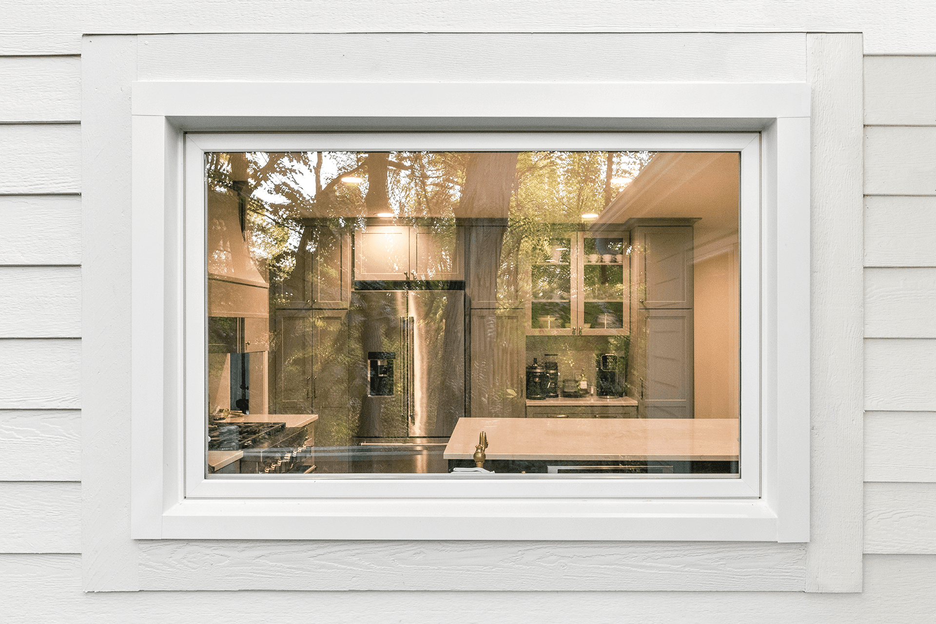 Exterior view of a white Infinity awning window.