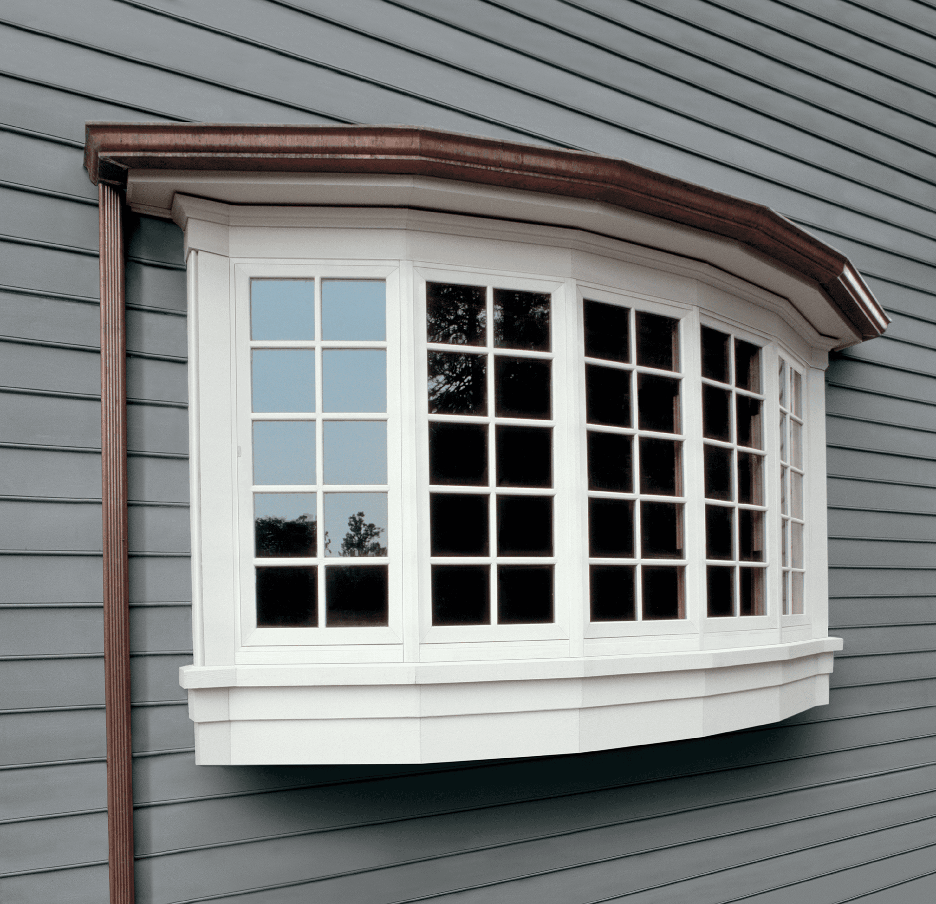 Exterior view of a five-wide white Bow window.