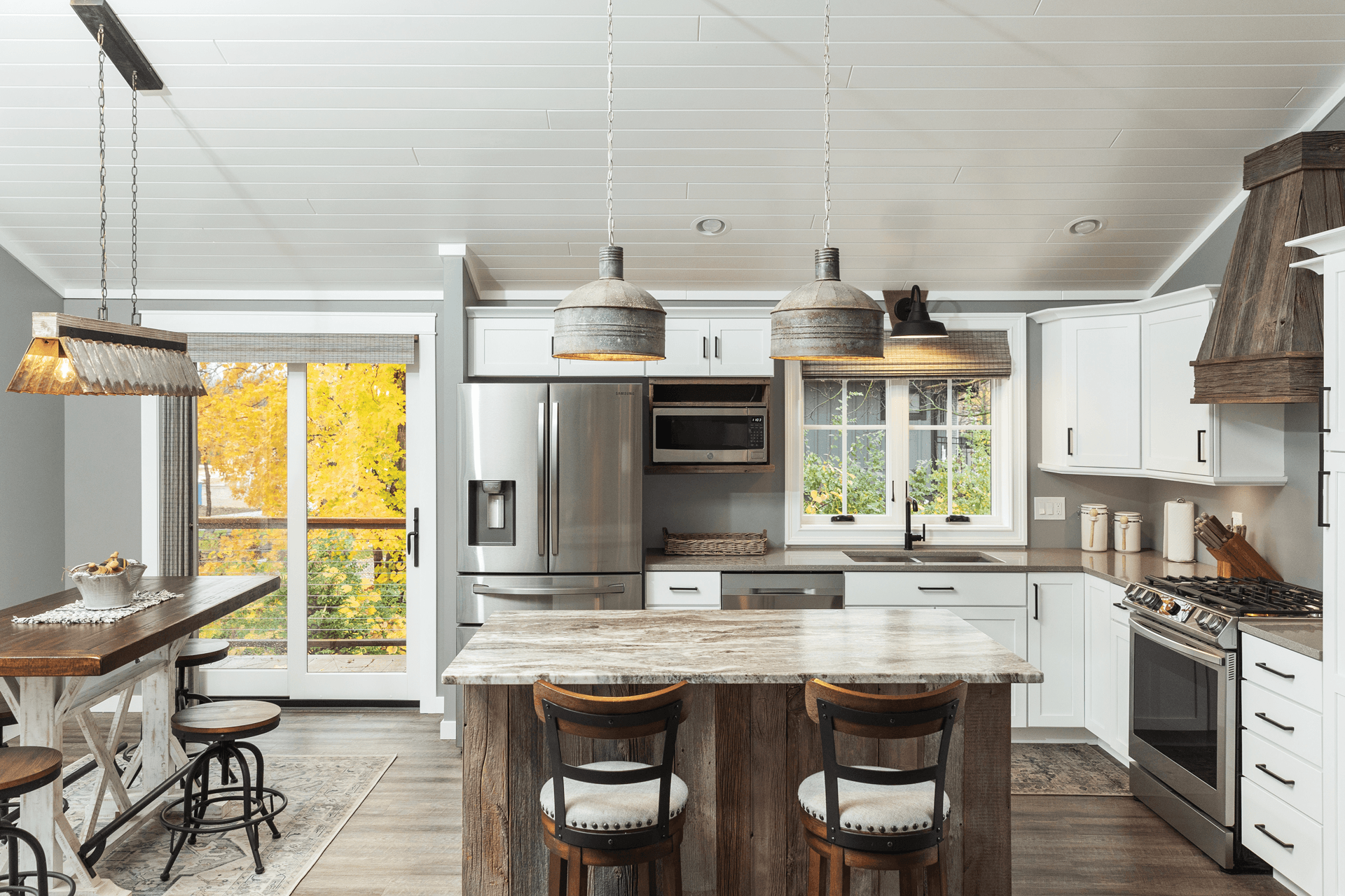 An open concept kitchen with Infinity from Marvin windows and doors.